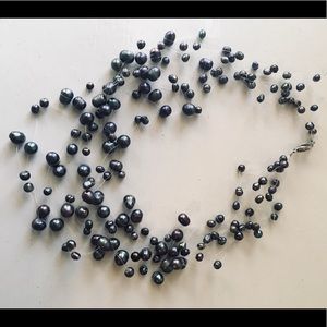 Multi-strand floating black pearl necklace